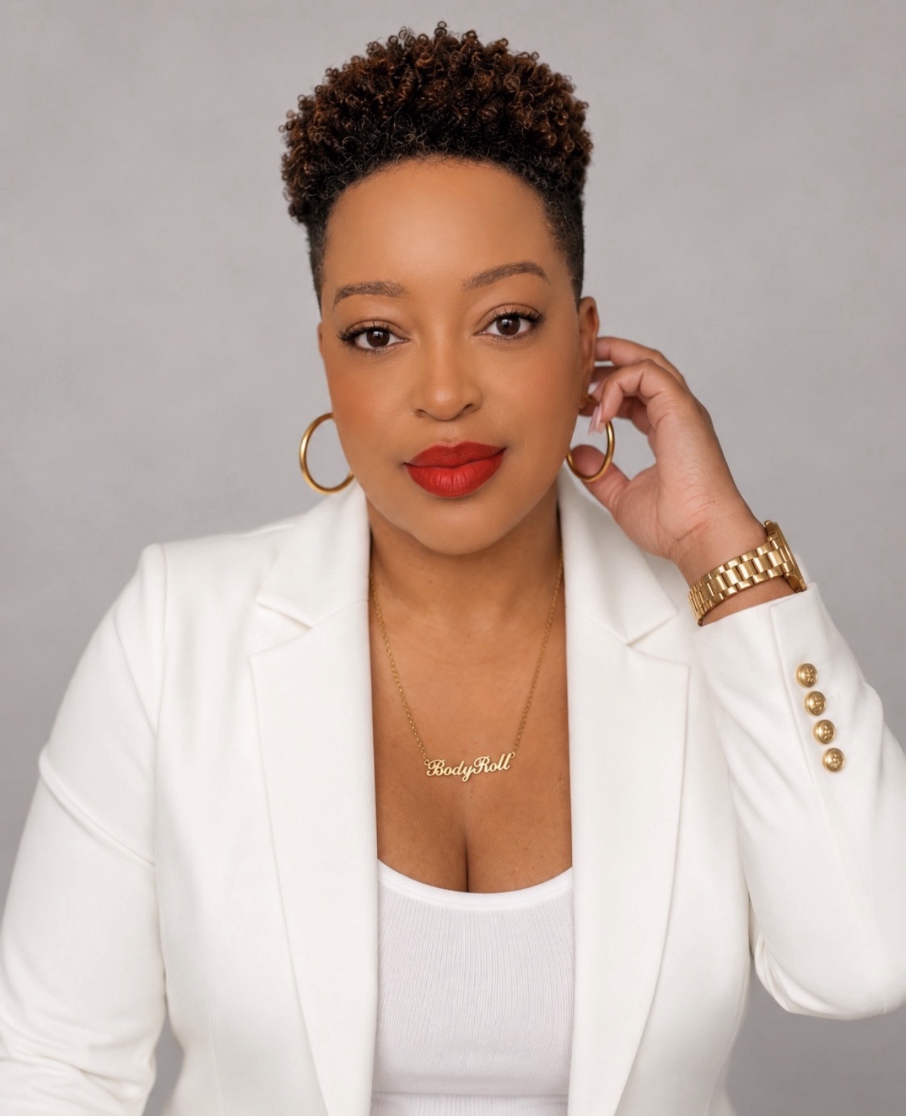 Carla D. Brown in a white blazer